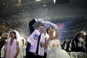 A newlywed couple celebrates during a mass wedding ceremony of the Unification Church at Cheongshim Peace World Centre in Gapyeong, South Korea, February 20, 2016. REUTERS/Kim Hong-Ji